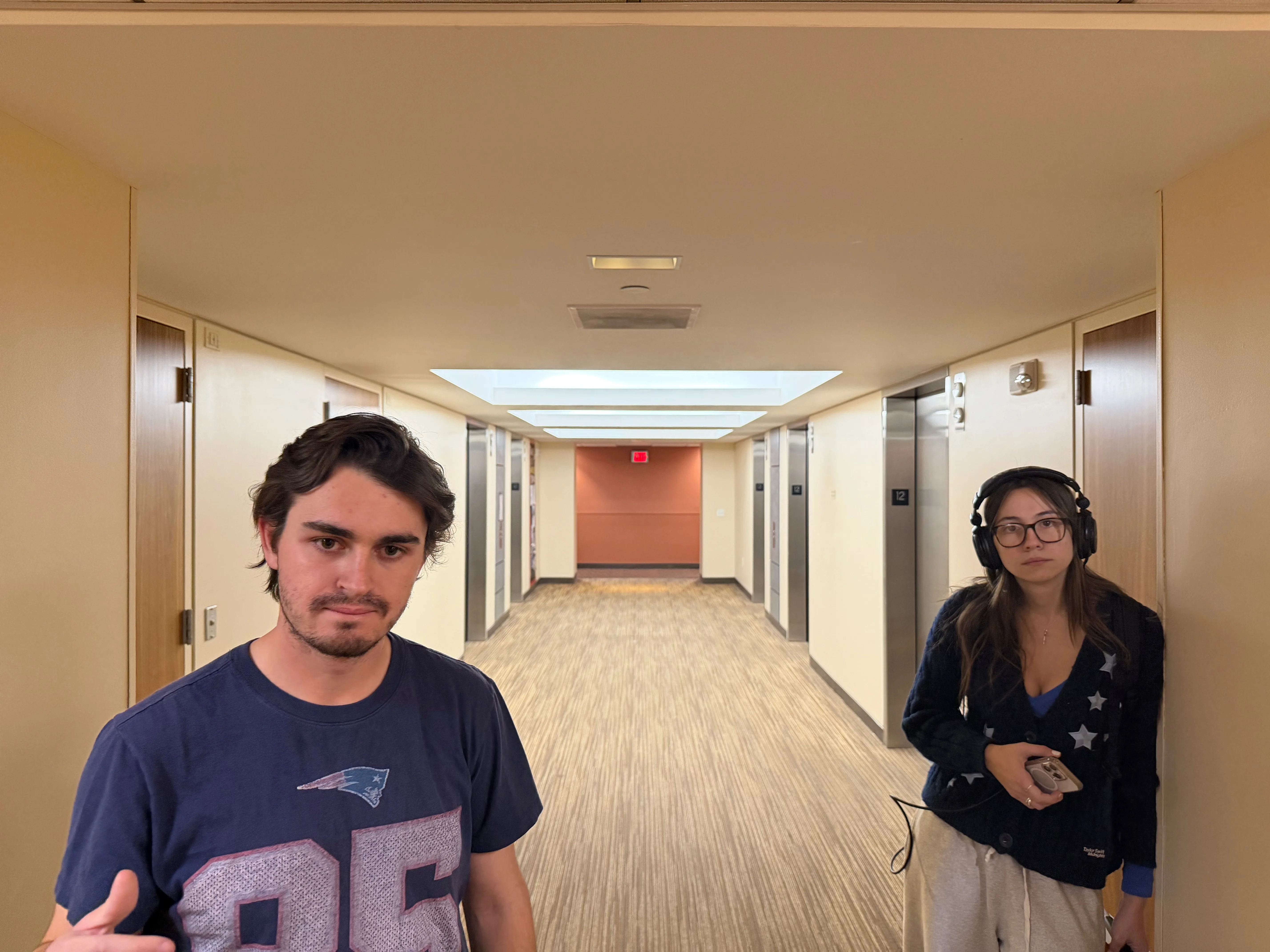 Two cast and crew members in the Elevator Pitch hallway