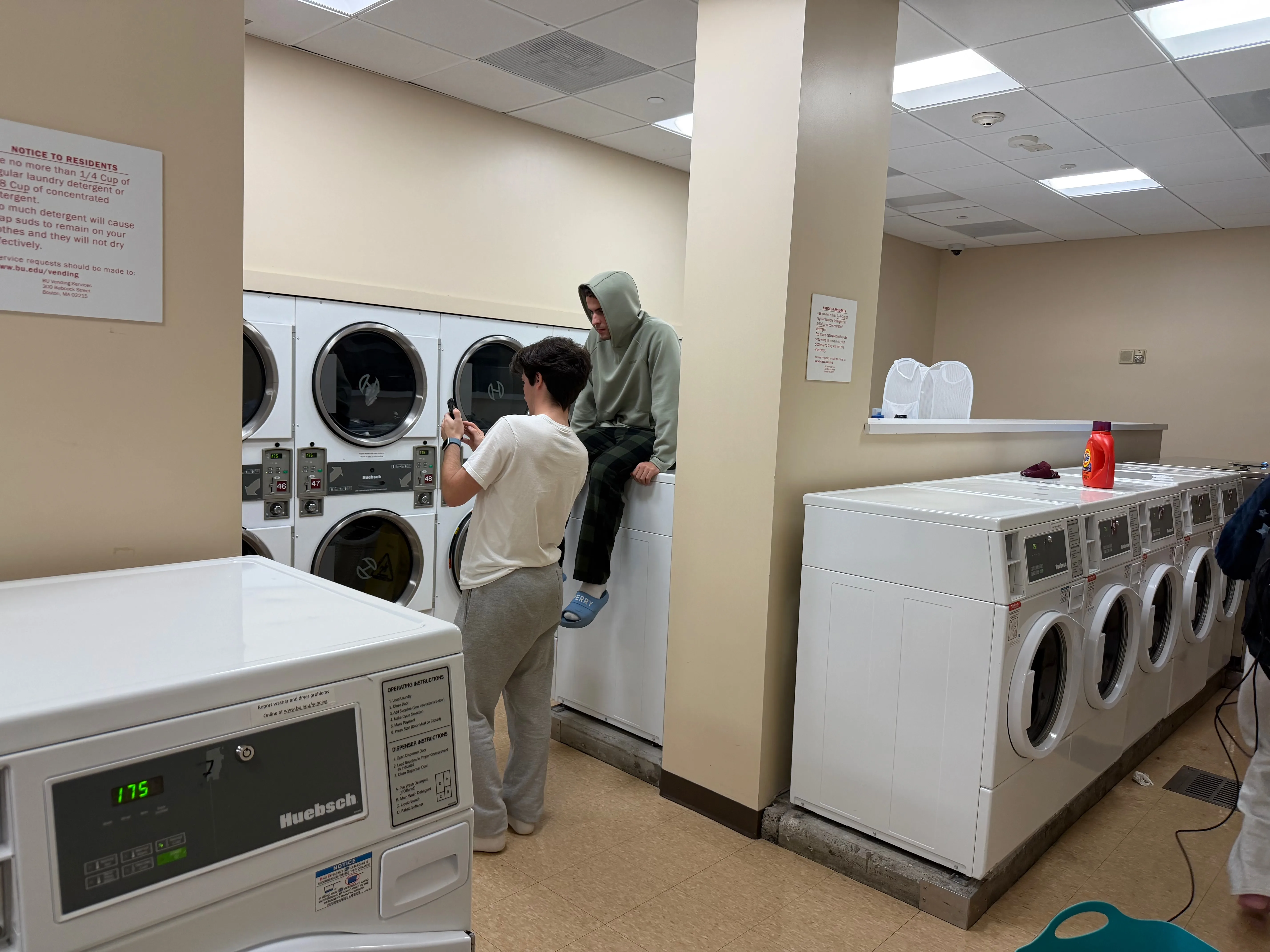 The Elevator Pitch crew filming in a laundromat