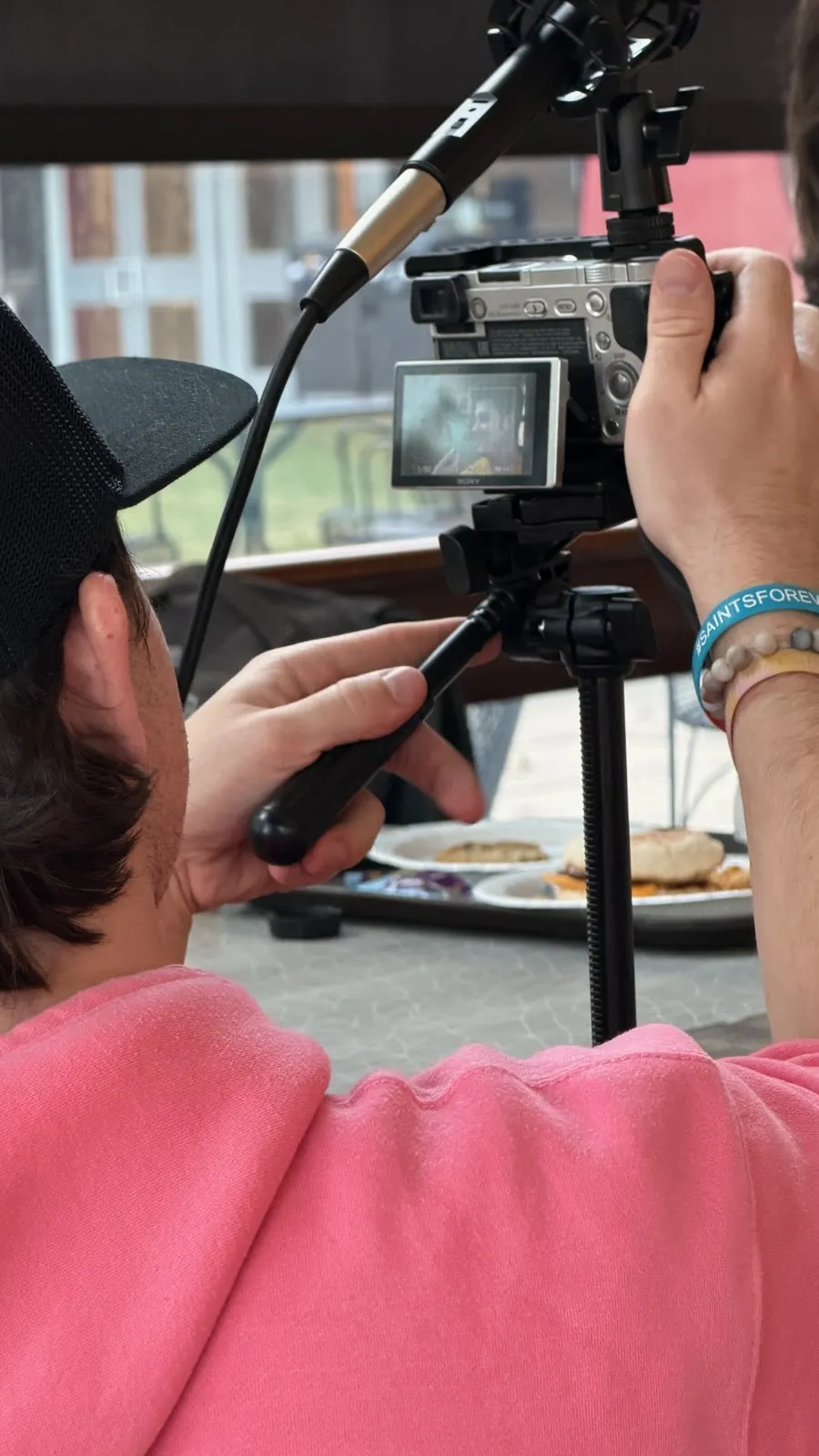 Cast and crew filming Trashboat in the dining hall